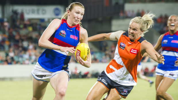 Phoebe McWilliams, in GWS colours, gives chase on Tiarna Ernst of the Bulldogs last season.