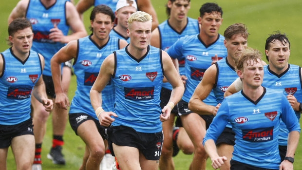 Nik Cox (centre) in action during an early pre-season running session.