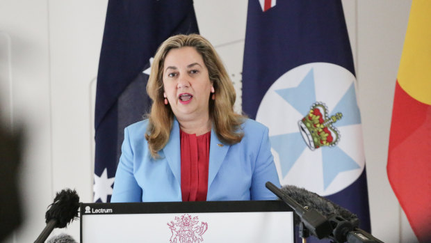 Queensland Premier Annastacia Palaszczuk’s office says a change to the Queensland flag (pictured behind her left shoulder) is “not being contemplated at this time”.