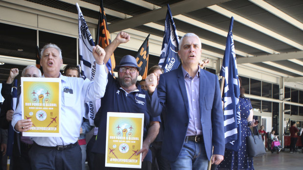 Michael Kaine leading a rally of airport employees protesting against working conditions at Sydney Airport last year.