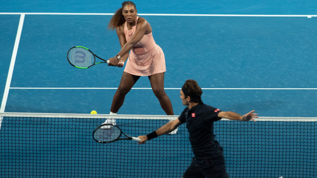 Serena Williams and Roger Federer in action during the mixed doubles match between Switzerland and the US.