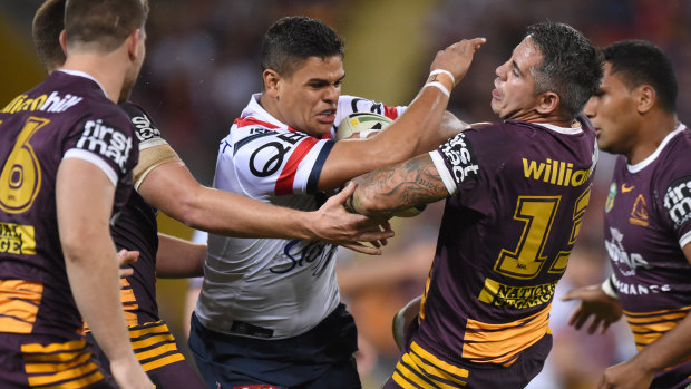 Strong-arm tactics: Latrell Mitchell holds off several defenders.