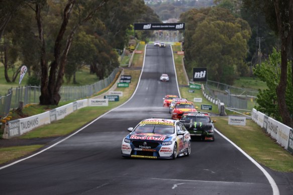 Shane van Gisbergen leads the field down Conrod Straight at Mount Panorama earlier this year.