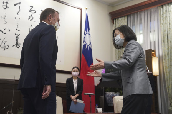 Taiwanese President Tsai Ing-wen, right, welcomes former Australian prime minister Tony Abbott during a meeting at the Presidential Office in Taipei on Thursday.