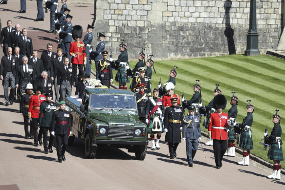 Prince Philip’s coffin, borne on the Land Rover he helped to design, is flanked by Pall Bearers during his funeral procession in 2021.