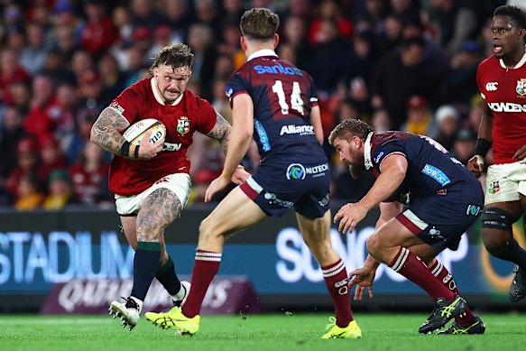 Andrew Porter of the British & Irish Lions makes a run at the Reds’ defence 