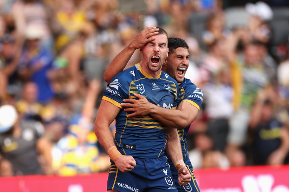 Clint Gutherson celebrates with Dylan Brown.