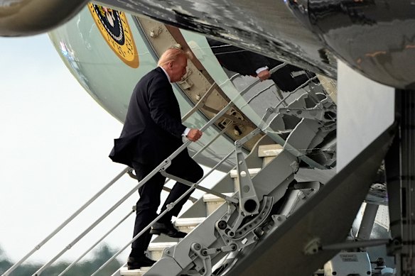 Donald Trump boards Air Force One on Sunday.