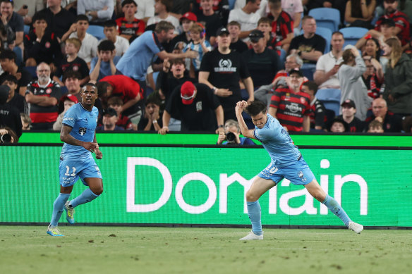 Joe Lolley celebrates his goal with a golf swing.