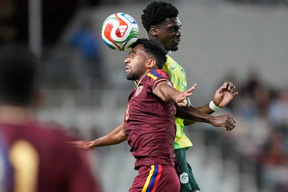 Casseres Yepez and Mohamed Toure compete for the ball.