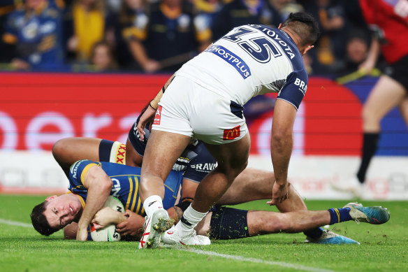 Mitchell Moses forces his way over for a late try to seal Parramatta’s victory.