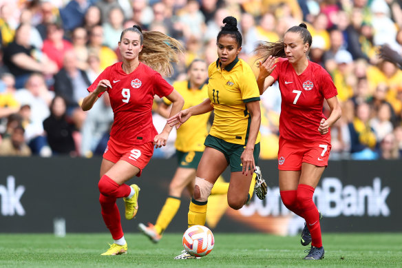 Mary Fowler cuts through the Canadian defence during their friendly last month in Brisbane.