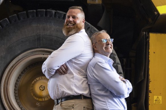Labor candidate for Hunter, Dan Repacholi and Opposition Leader Anthony Albanese pose for photos during a visit to the workshop at the Mount Thorley Warkworth mine.