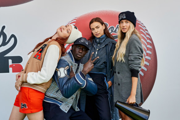 From left: Gigi Hadid, TikTok performer Khaby Lame, Irina Shayk and German athlete Alica Schmidt at the Boss x Russell Athletic show in Milan in 2021.
