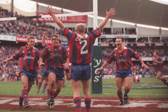 Iconic: Darren Albert scores for the Knights to win the 1997 grand final.