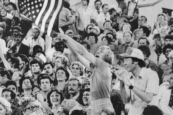 A spectator waves the American flag at the closing ceremony Lenin Stadium on August 3, 1980. 