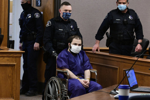 Ahmad Al Aliwi Alissa, 21, appears in a Boulder court in a wheelchair.