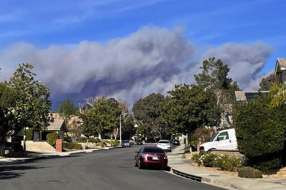 Smoke rises from Castaic Lake over Santa Clarita, California.