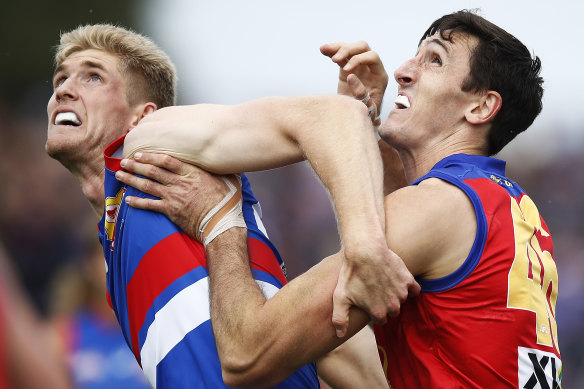 Bulldog Tim English battles with Lion Oscar McInerney.