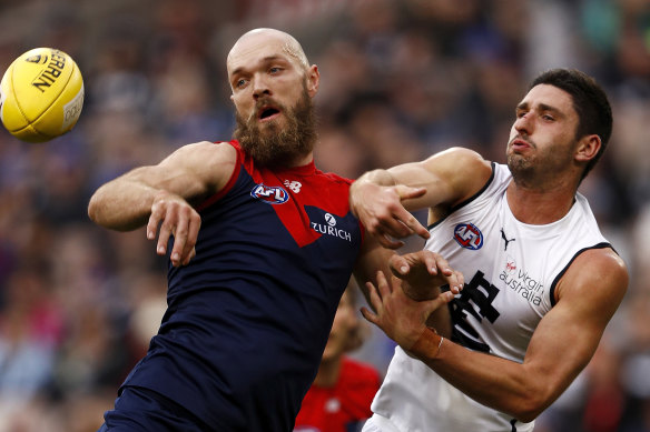 Max Gawn gets the edge on Marc Pittonet.