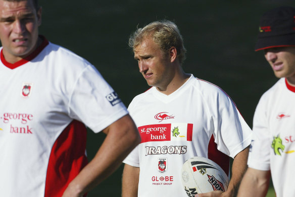 Jason Ryles (left) and Ben Hornby (right) with former coach Nathan Brown during their playing days.