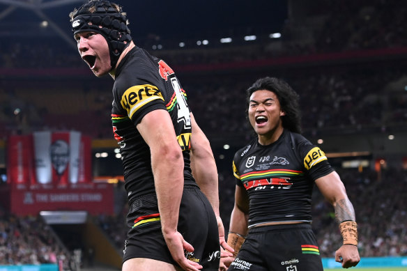 Matt Burton is over-joyed to score the first try of the grand final, as teammate Brian To’o celebrates with him.
