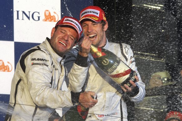Jenson Button celebrates winning the 2009 Australian F1 Grand Prix in Melbourne for Brawn with teammate Rubens Barrichello, who ran second.
