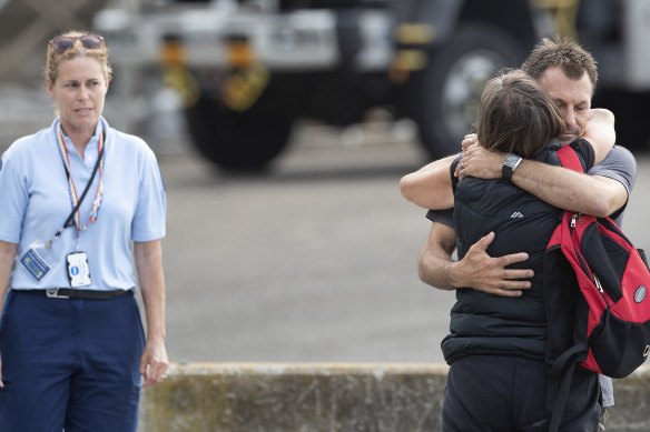 Family members of the victims of the White Island disaster returned to shore after marking a minute's silence on board a ship near the island on Monday.