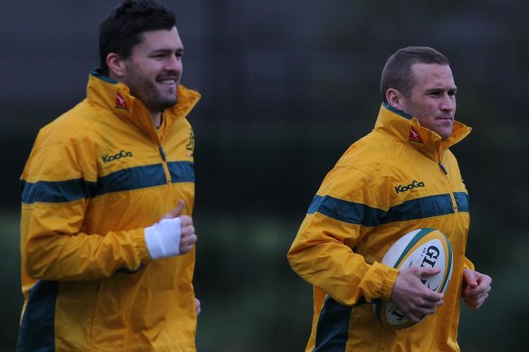 Ashley-Cooper and Giteau warm up at Wallabies training in 2011.