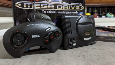 The system comes with two full-sized replicas of the original three-button controller.