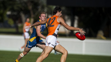 Quantum leap: Giant Jack Stein takes a shot in goal in the NEAFL competition.