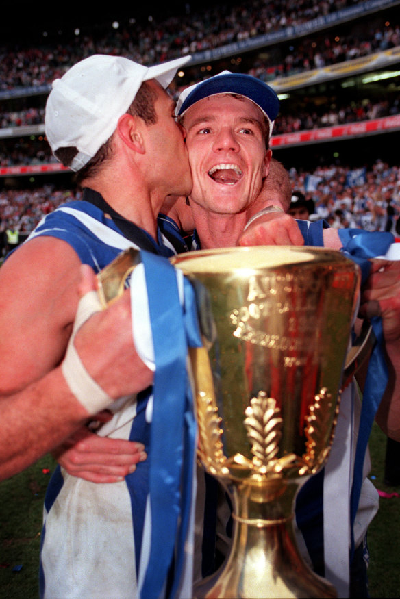 Wayne Schwass kisses Laidley after the Roos win the 1996 grand final.