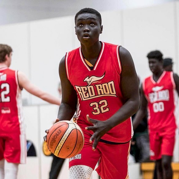 Moses Riek playing basketball as a teenager.
