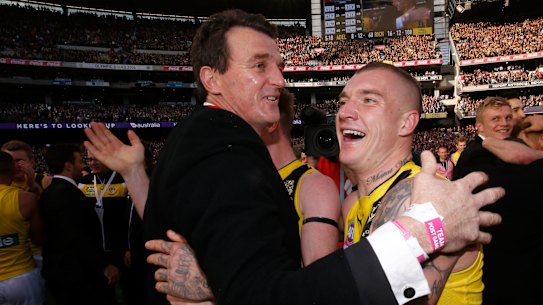Brendon Gale (left) and Dustin Martin embrace after the 2017 grand final. 