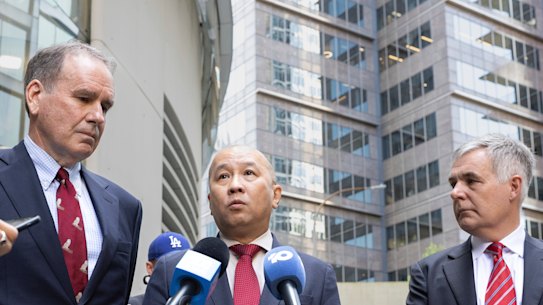 Optus chair John Arthur, Singtel CEO Kuan Moon Yuen, and Optus CEO Stephen Rue speak to media following a meeting with communications minister Anika Wells.