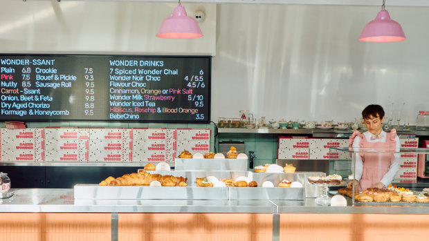 Staff at Baked Wonder in Burwood East wear frilly pink uniforms.