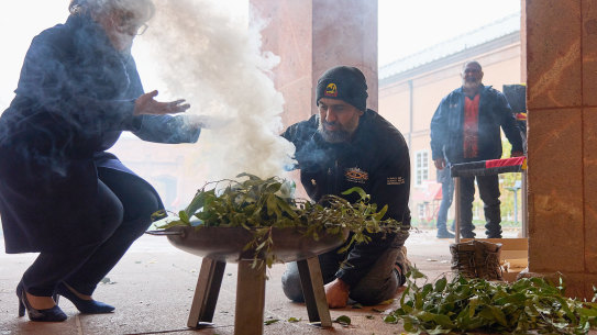 A traditional smoking ceremony, which has cleansing properties and the ability to ward off bad spirits and make pathway for a brighter future, is performed in Leipzig.