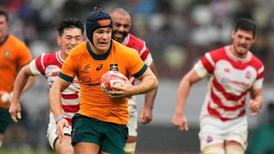 Australia’s Josh Flook runs to scores a try.