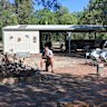 Charleville Bush Caravan Park operator 66-year-old Matthew Bom sits near his site’s empty fire pit area. Each night, he would usually be surrounded by travellers sharing their stories, but not this year. 