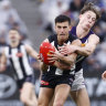 AFL flag favourite Magpies cruise past Dockers