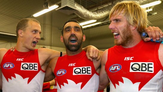 Ted Richards, Adam Goodes and Lewis Roberts-Thomson of the Swans sing the club song after during the second AFL Preliminary Final match between the Sydney Swans and the Collingwood Magpies at ANZ Stadium on September 21, 2012 in Sydney, Australia.  (Photo by Ryan Pierse/Getty Images) .