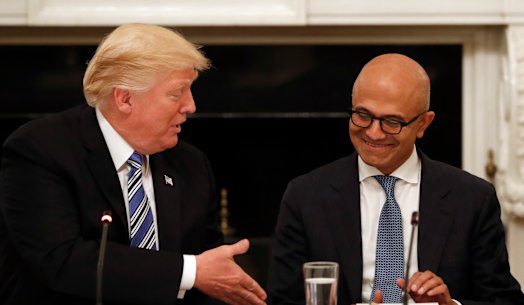 Donald Trump with Microsoft chief Satya Nadella. Amazon claimed the former US president stepped in to thwart its bid for the lucrative contract.