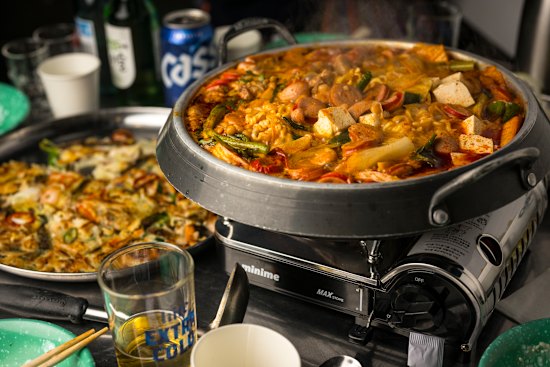 Army stew (budae jjigae) with sausages, beans, tofu and kimchi.