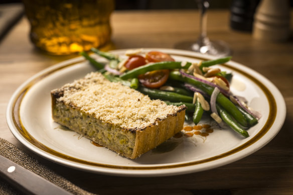 Leek and truffle tart with green beans, cherry tomatoes and almonds.