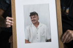 Stacey Chater with her husband Ralph with a photo of their son Brayden. They are coming up to their second Christmas without her son Brayden, who died suddenly after contracting meningococcal B. December 19, 2023. Photo: Louise Kennerley SMH