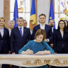 President Maia Sandu signs the decree initiating Moldova’s EU accession negotiations, in Chisinau in June.