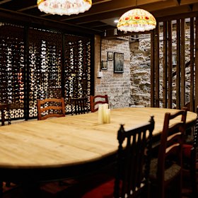 Downstairs, in the wine cellar, a private dining room accommodates up to 14 guests.