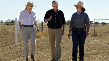 Mr Shorten (centre) and wife Chloe (left) discuss rural issues with grazier Jody Brown in Longreach last month.