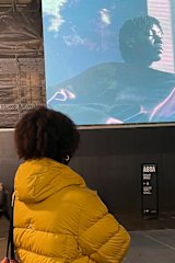 Atong Atem looks at her video work Banksia at Illuminate Adelaide 2021.