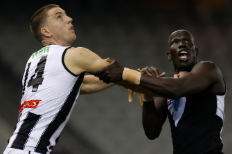 Darcy Cameron works for position against Aliir Aliir.